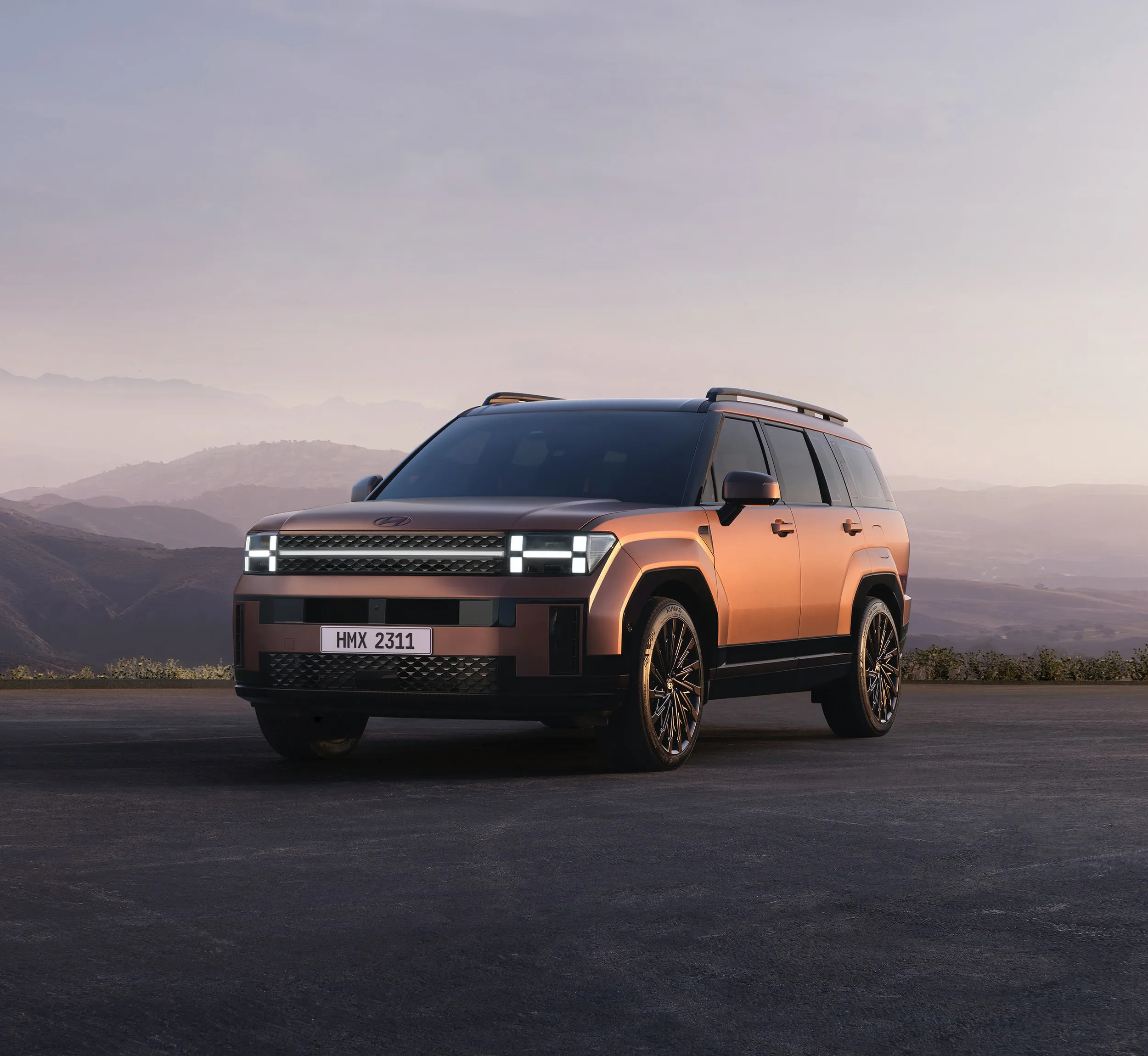 Copper SUV parked at a mountain overlook