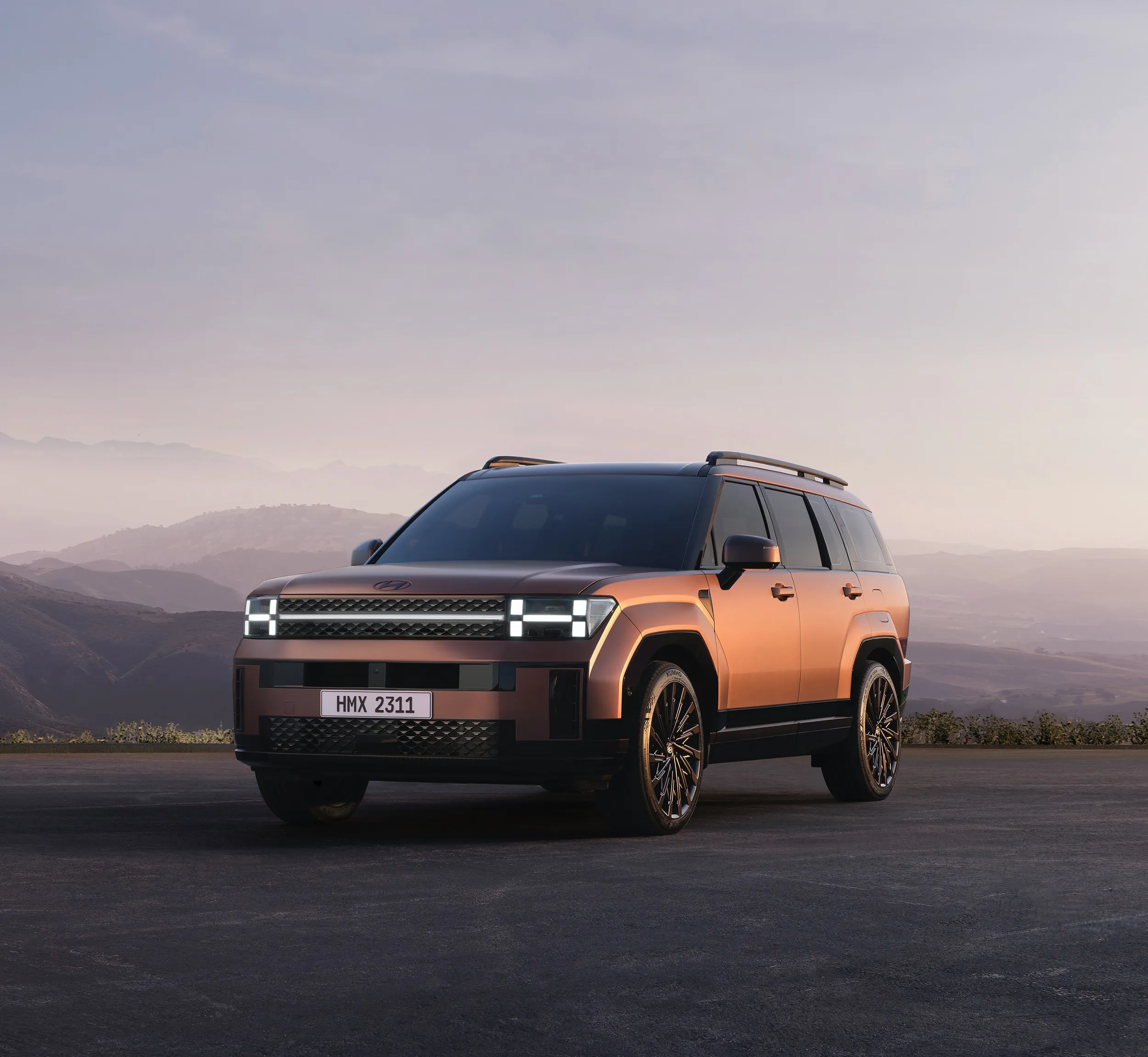 SUV parked at a mountain overlook at dusk