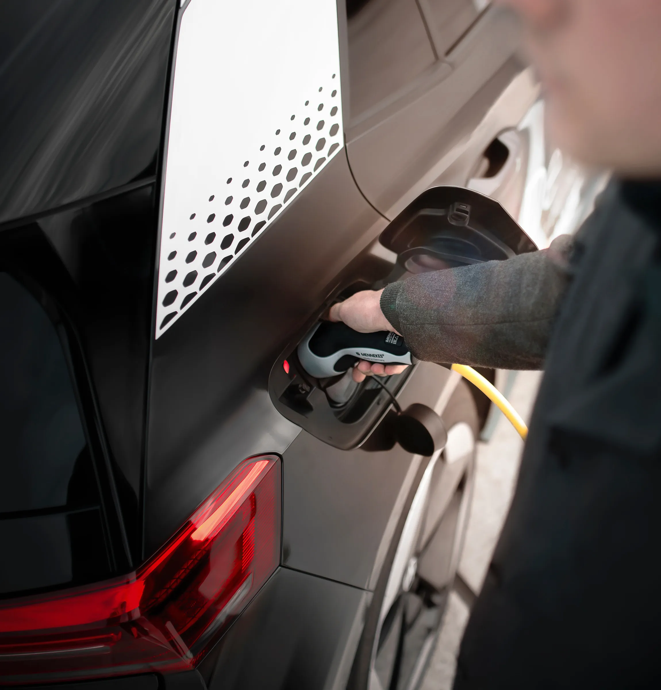 Technician working on the side of a car